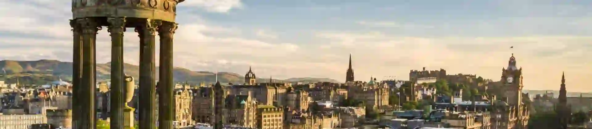 Edinburgh skyline at sunset from Calton Hill, with the Dugald Stewart Monument in the foreground