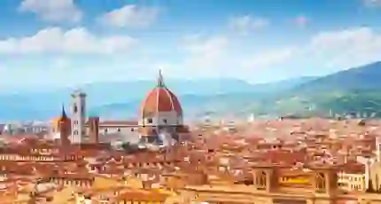Panoramic view of Florence, Italy, with the Cathedral of Santa Maria del Fiore rising amongst the terracotta rooftops