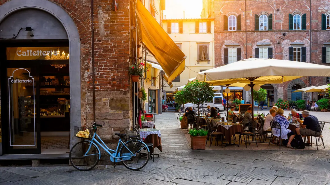 Café in Lucca, Tuscany, with people sat outside 